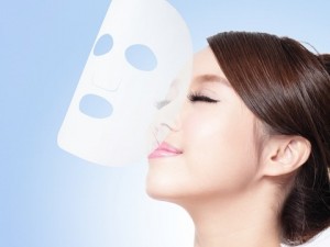Relax Young woman with cloth facial mask
